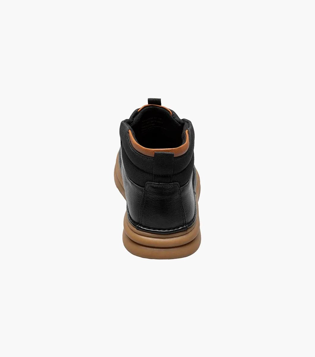 The Stacy Adams DELSON Plain Toe Chukka Boot in black features an ankle-high design with a brown rubber sole, a lace-up closure, and added arch support for comfort.