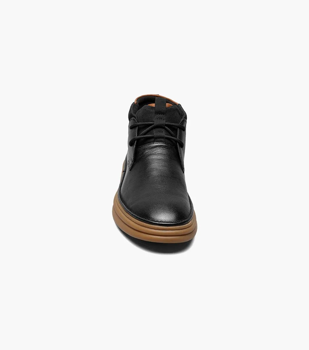 The Stacy Adams DELSON Plain Toe Chukka Boot in black features an ankle-high design with a brown rubber sole, a lace-up closure, and added arch support for comfort.