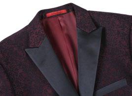 Displayed on a mannequin, the Renoir Alessandro Vitello Burgundy Slim Fit Tuxedo Blazer exudes elegance with its maroon and black textured fabric. Paired with a light blue and white striped tie, its subtle embroidered pattern effortlessly complements the formal dress code.