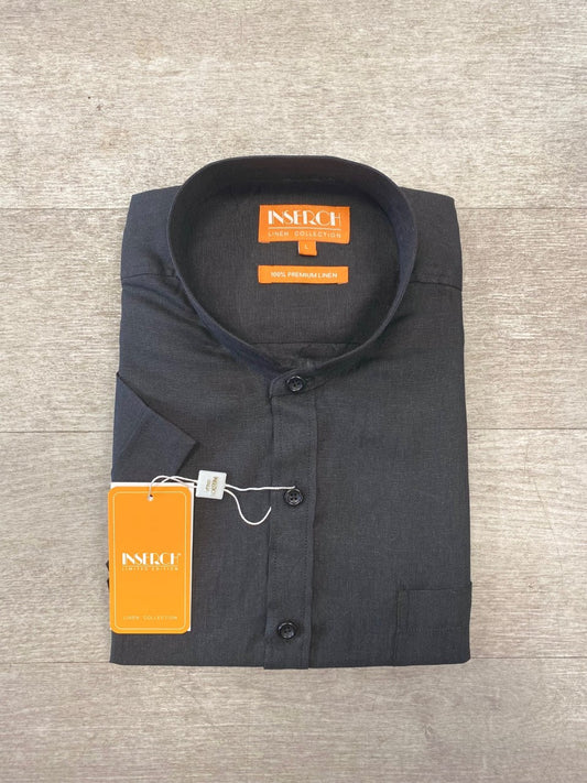 Folded black banded collar short sleeve shirt from Inserch with a brand label on the collar and a price tag attached.